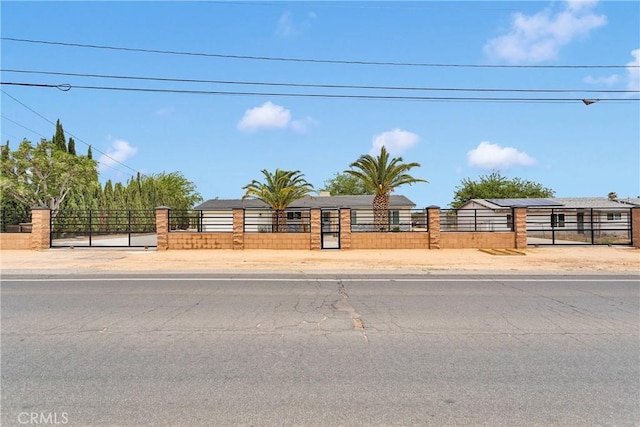 15074 Willow St, Hesperia, CA 92345 - view of front of home with a fenced front yard and a gate