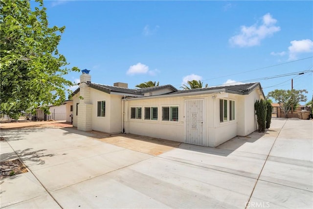 15074 Willow St, Hesperia, CA 92345 - view of front of property with fence, a patio area, and stucco siding