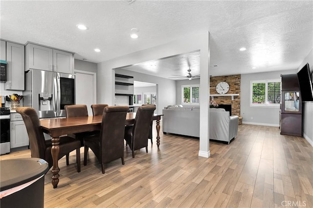 15074 Willow St, Hesperia, CA 92345 - dining room with a ceiling fan, a textured ceiling, light wood-style floors, recessed lighting, and baseboards