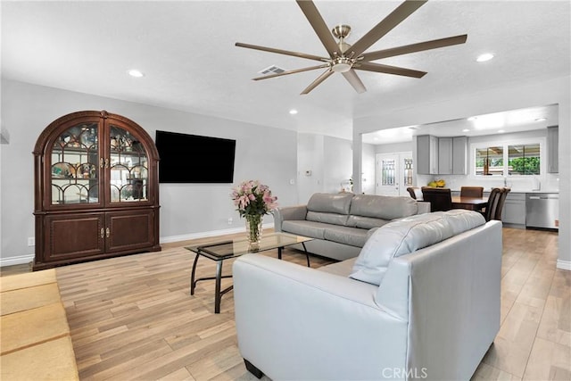 15074 Willow St, Hesperia, CA 92345 - living area with ceiling fan, light wood-style floors, recessed lighting, baseboards, and a textured ceiling