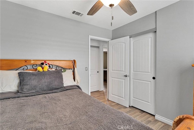 15074 Willow St, Hesperia, CA 92345 - bedroom with light wood-style flooring, baseboards, and ceiling fan