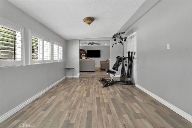 15074 Willow St, Hesperia, CA 92345 - exercise room featuring wood finished floors, baseboards, a textured ceiling, and a ceiling fan