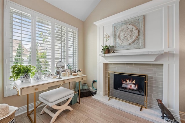 45 Northampton Ct, Newport Beach, CA 92660 - living area with lofted ceiling, wood finished floors, and a tile fireplace
