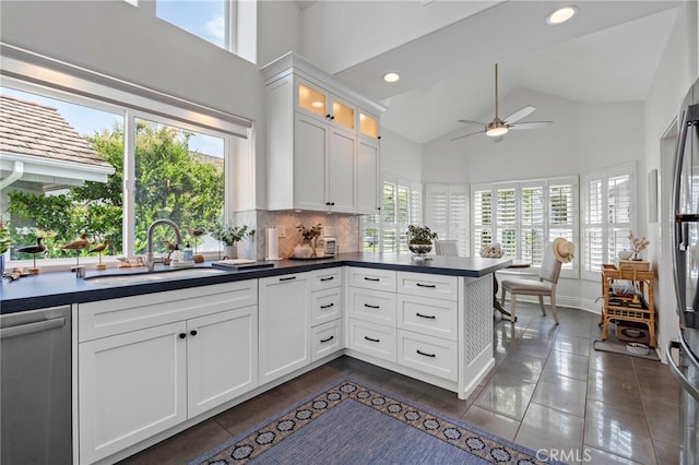 45 Northampton Ct, Newport Beach, CA 92660 - kitchen featuring a sink, stainless steel dishwasher, ceiling fan, high vaulted ceiling, and dark countertops