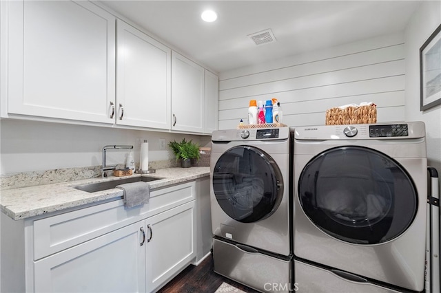 45 Northampton Ct, Newport Beach, CA 92660 - washroom featuring washing machine and clothes dryer, cabinet space, dark wood-style floors, wood walls, and recessed lighting