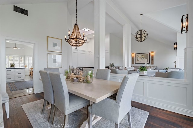 45 Northampton Ct, Newport Beach, CA 92660 - dining room featuring high vaulted ceiling, dark wood-style floors, a chandelier, beamed ceiling, and a decorative wall