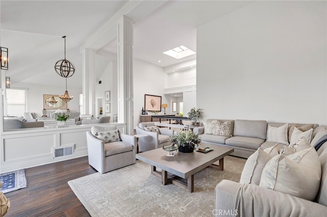 45 Northampton Ct, Newport Beach, CA 92660 - living room with dark wood-style flooring, high vaulted ceiling, and a chandelier