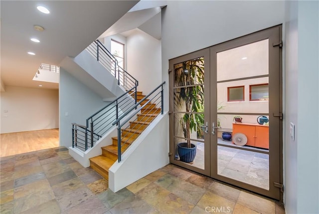 143 Union Jack Mall, Marina Del Rey, CA 90292 - staircase with stone tile flooring, recessed lighting, and french doors