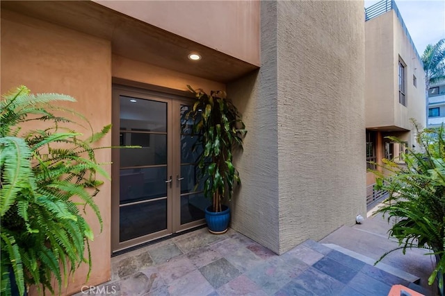 143 Union Jack Mall, Marina Del Rey, CA 90292 - view of exterior entry with french doors, stucco siding, and a patio area