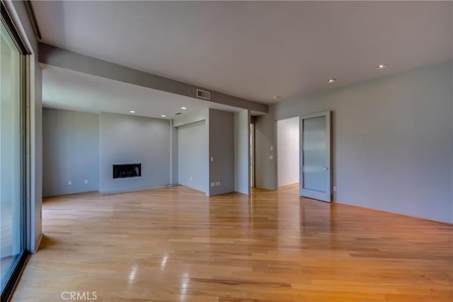 143 Union Jack Mall, Marina Del Rey, CA 90292 - unfurnished living room featuring light wood finished floors, a fireplace, and recessed lighting