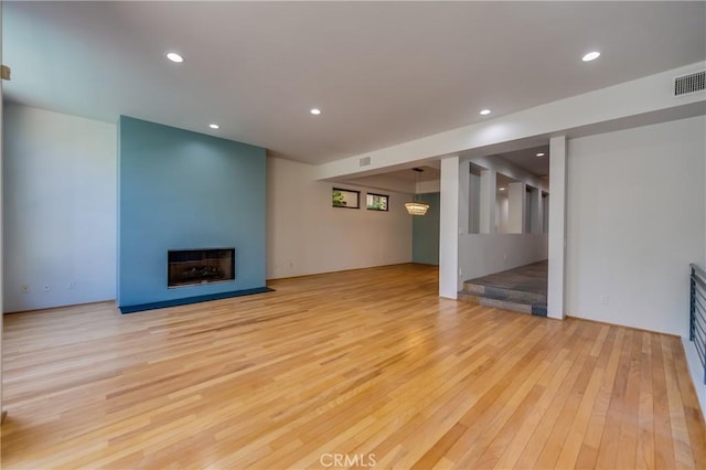 143 Union Jack Mall, Marina Del Rey, CA 90292 - unfurnished living room with light wood finished floors, recessed lighting, and a large fireplace