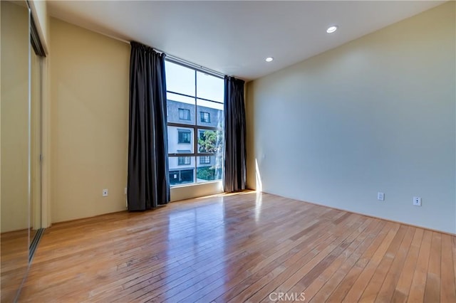 143 Union Jack Mall, Marina Del Rey, CA 90292 - unfurnished room featuring light wood finished floors, recessed lighting, and a wall of windows