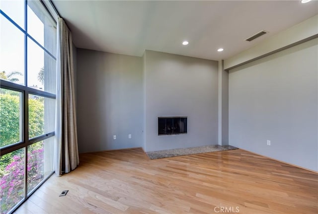 143 Union Jack Mall, Marina Del Rey, CA 90292 - unfurnished living room with light wood finished floors, a glass covered fireplace, and recessed lighting