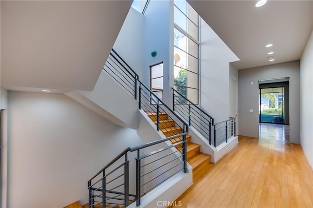 143 Union Jack Mall, Marina Del Rey, CA 90292 - stairway with recessed lighting, hardwood / wood-style flooring, and a towering ceiling