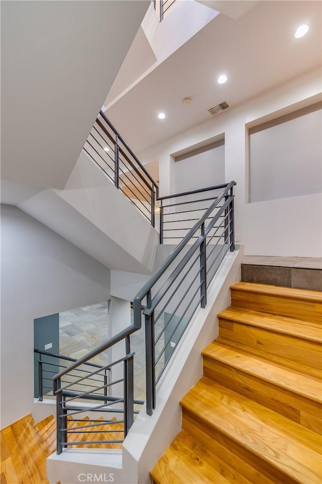 143 Union Jack Mall, Marina Del Rey, CA 90292 - staircase with a towering ceiling, recessed lighting, and wood finished floors