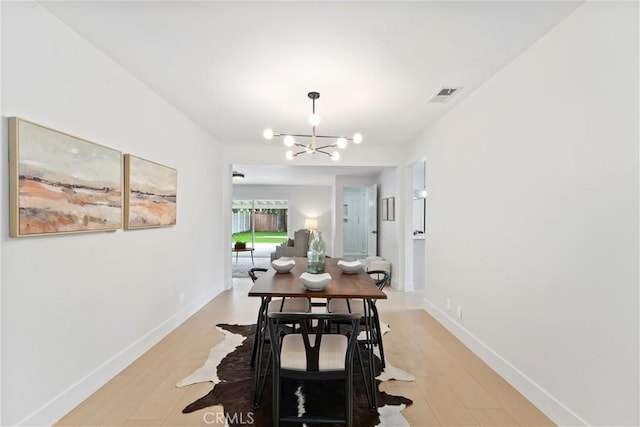 420 W Bennett Ave, Glendora, CA 91741 - dining space with a chandelier, light wood-style floors, and baseboards