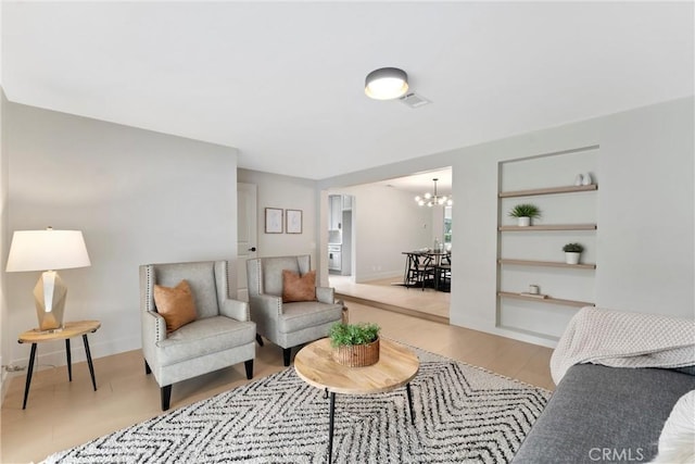 420 W Bennett Ave, Glendora, CA 91741 - living room with a chandelier, wood finished floors, baseboards, and built in features