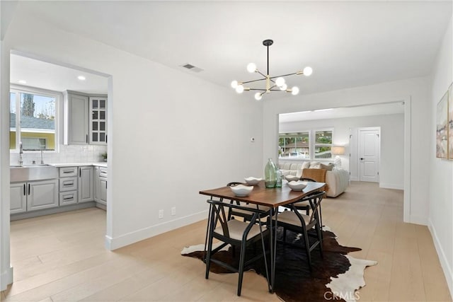 420 W Bennett Ave, Glendora, CA 91741 - dining room with a chandelier, light wood-type flooring, baseboards, and recessed lighting