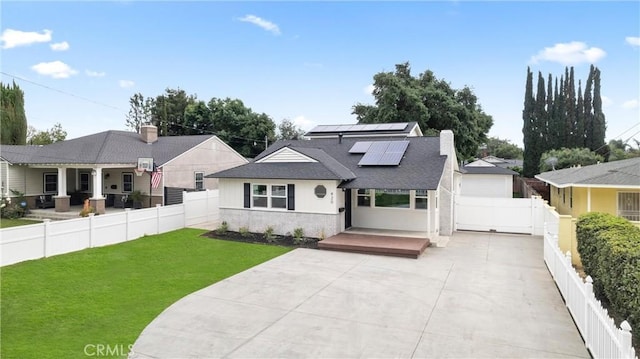 420 W Bennett Ave, Glendora, CA 91741 - view of front of home featuring roof mounted solar panels, a chimney, concrete driveway, and roof with shingles