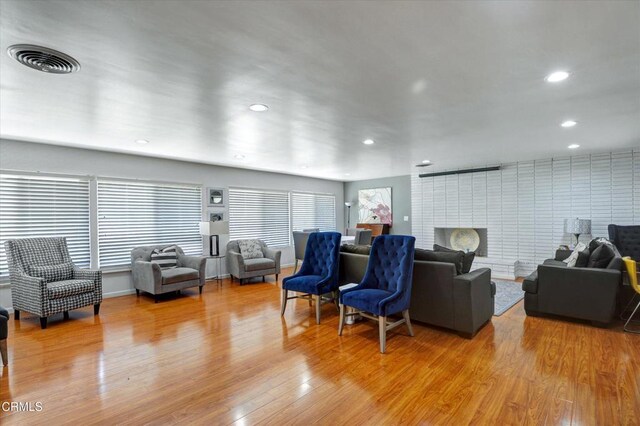 living room featuring light wood-type flooring and recessed lighting