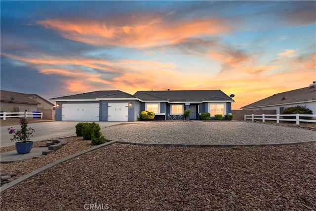 21269 Chardonnay Dr, Apple Valley, CA 92308 - view of front of house with driveway, fence, a garage, a tiled roof, and stucco siding