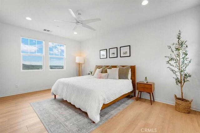 10243 Graphite St, Spring Valley, CA 91977 - bedroom with light wood-type flooring, recessed lighting, baseboards, and ceiling fan