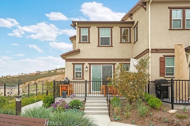 10243 Graphite St, Spring Valley, CA 91977 - townhome / multi-family property with stucco siding and fence