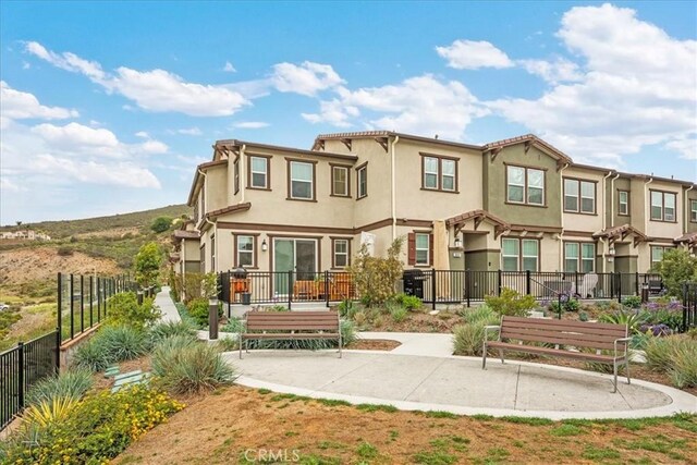 10243 Graphite St, Spring Valley, CA 91977 - rear view of property featuring fence and stucco siding