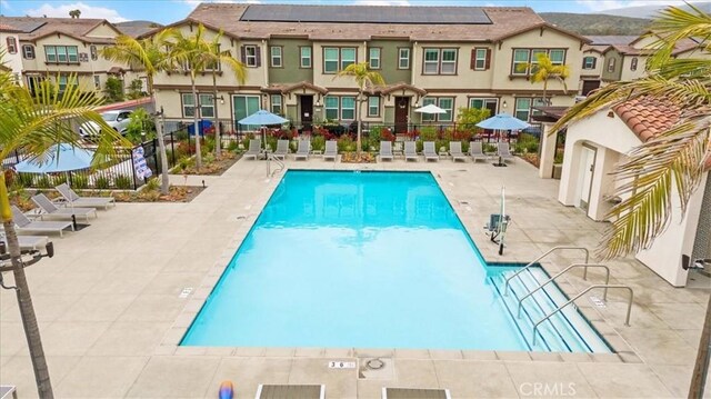 10243 Graphite St, Spring Valley, CA 91977 - community pool featuring fence, a patio, and a residential view