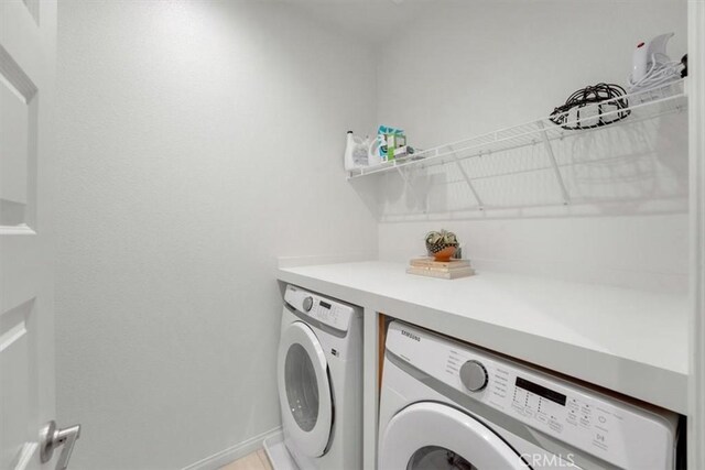 10243 Graphite St, Spring Valley, CA 91977 - laundry room with independent washer and dryer and baseboards