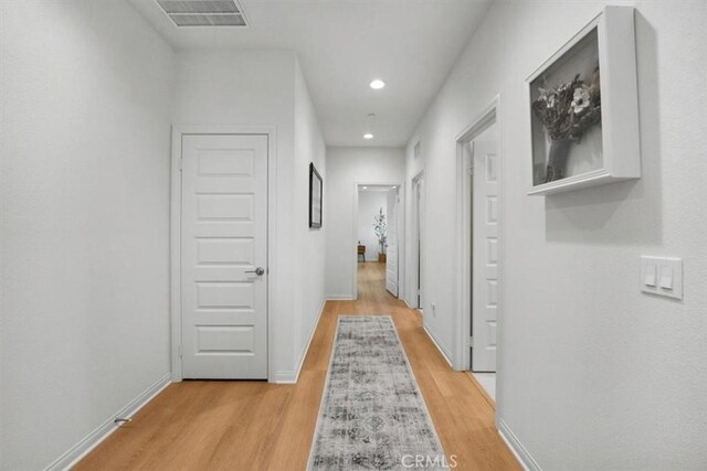 10243 Graphite St, Spring Valley, CA 91977 - hall with light wood-type flooring, baseboards, and recessed lighting