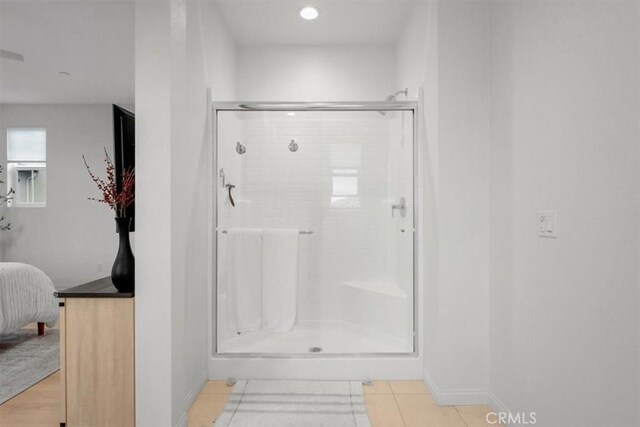 10243 Graphite St, Spring Valley, CA 91977 - full bathroom with a stall shower, connected bathroom, baseboards, tile patterned floors, and recessed lighting