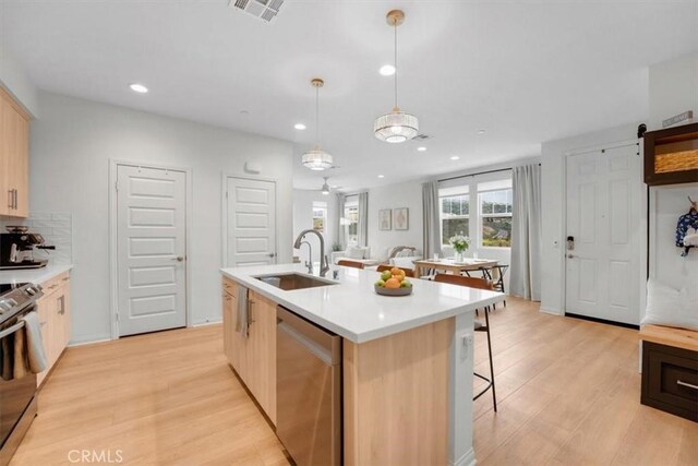 10243 Graphite St, Spring Valley, CA 91977 - kitchen with stainless steel dishwasher, a sink, electric stove, light countertops, and recessed lighting