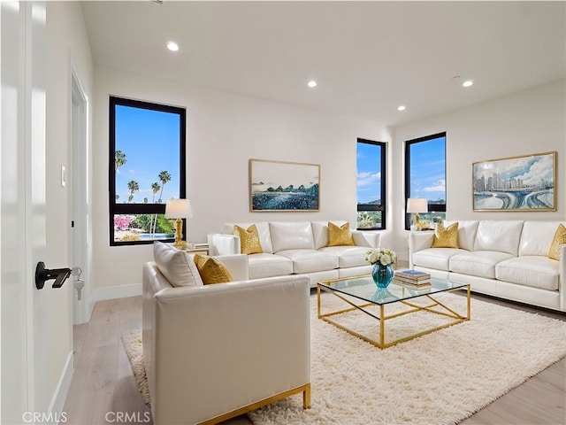 3810 Locke Ave, Los Angeles, CA 90032 - living room with recessed lighting, plenty of natural light, light wood-style flooring, and baseboards