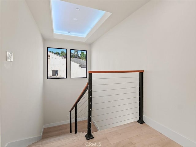 3810 Locke Ave, Los Angeles, CA 90032 - stairs with a skylight, wood finished floors, baseboards, and a raised ceiling