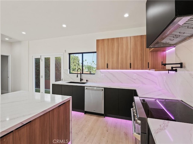 3810 Locke Ave, Los Angeles, CA 90032 - kitchen featuring appliances with stainless steel finishes, a sink, wall chimney exhaust hood, light wood finished floors, and brown cabinets