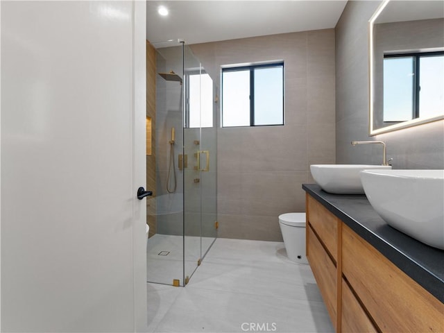 3810 Locke Ave, Los Angeles, CA 90032 - full bath featuring tile walls, plenty of natural light, a shower stall, double vanity, and toilet