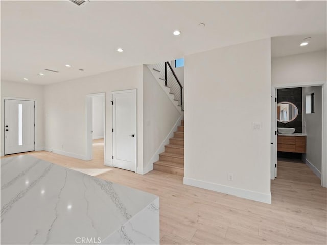 3810 Locke Ave, Los Angeles, CA 90032 - entryway with light wood-style floors, stairway, baseboards, and recessed lighting