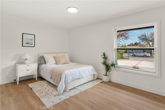 1825 W Carlton Pl, Santa Ana, CA 92704 - bedroom with baseboards and light wood-type flooring
