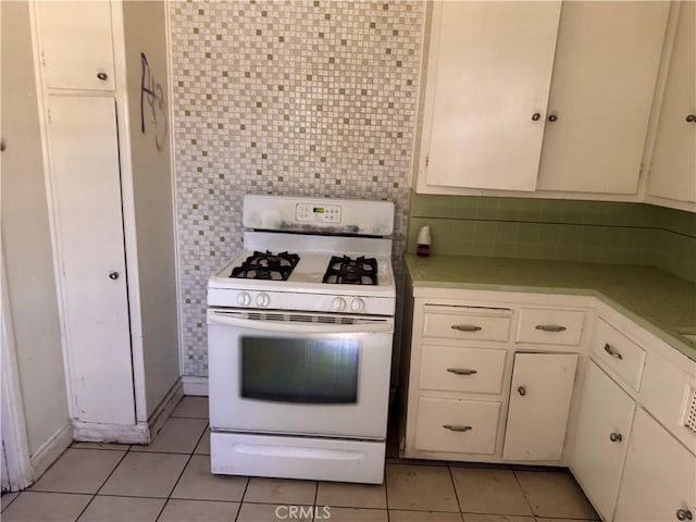 925 E Appleton St Unit 4, Long Beach, CA 90802 - kitchen featuring gas range gas stove, light tile patterned floors, light countertops, and tasteful backsplash