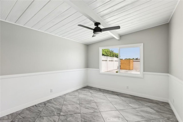 empty room featuring a ceiling fan, beamed ceiling, wooden ceiling, baseboards, and light marble finish floors