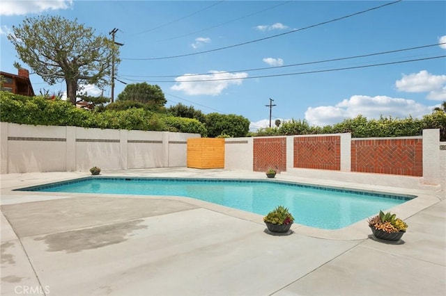 view of pool featuring a fenced backyard and a patio area