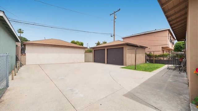 detached garage with fence