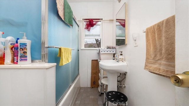 bathroom featuring enclosed tub / shower combo