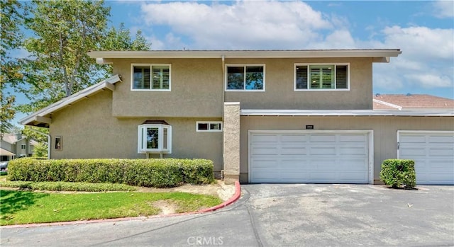 5855 Via Sonora Unit 39, Yorba Linda, CA 92887 - view of front of house with driveway and stucco siding