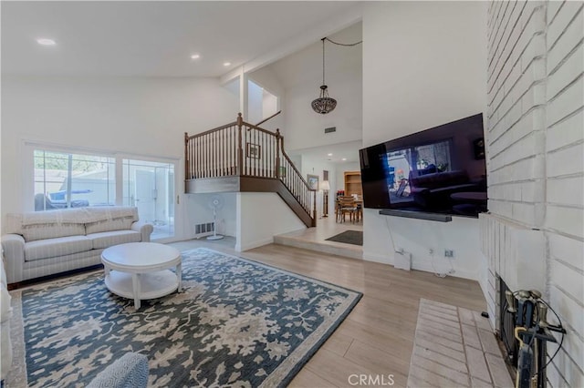 5855 Via Sonora Unit 39, Yorba Linda, CA 92887 - living room with high vaulted ceiling, stairway, wood finished floors, recessed lighting, and baseboards