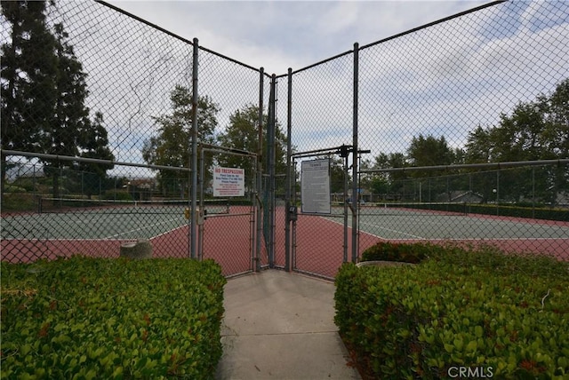 5855 Via Sonora Unit 39, Yorba Linda, CA 92887 - view of tennis court with a gate and fence