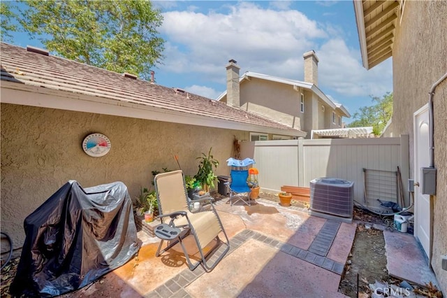 5855 Via Sonora Unit 39, Yorba Linda, CA 92887 - view of patio / terrace with cooling unit, fence, and grilling area