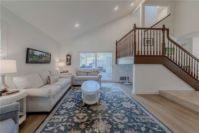 5855 Via Sonora Unit 39, Yorba Linda, CA 92887 - living room featuring wood finished floors, stairs, high vaulted ceiling, recessed lighting, and baseboards