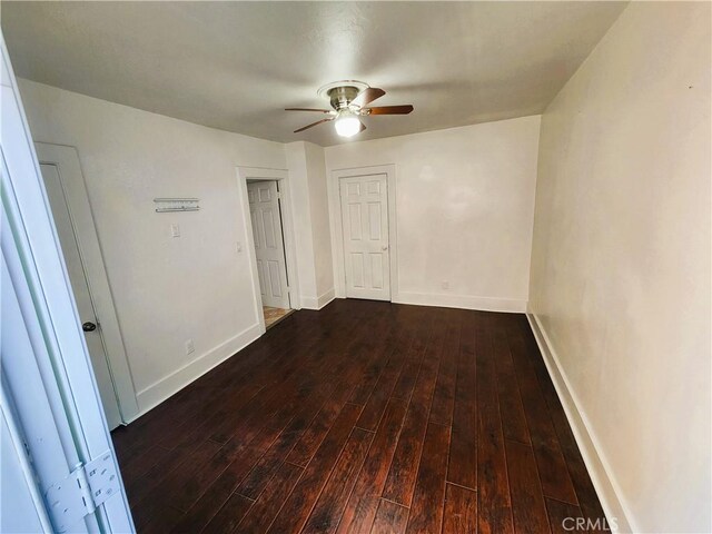 1210 W Manchester Ave, Los Angeles, CA 90044 - empty room featuring ceiling fan, wood finished floors, and baseboards